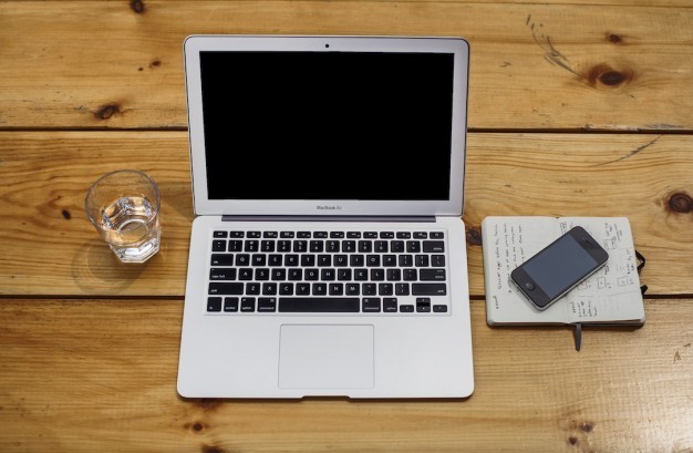 open-laptop-on-old-wooden-desk_426-19315259.jpg