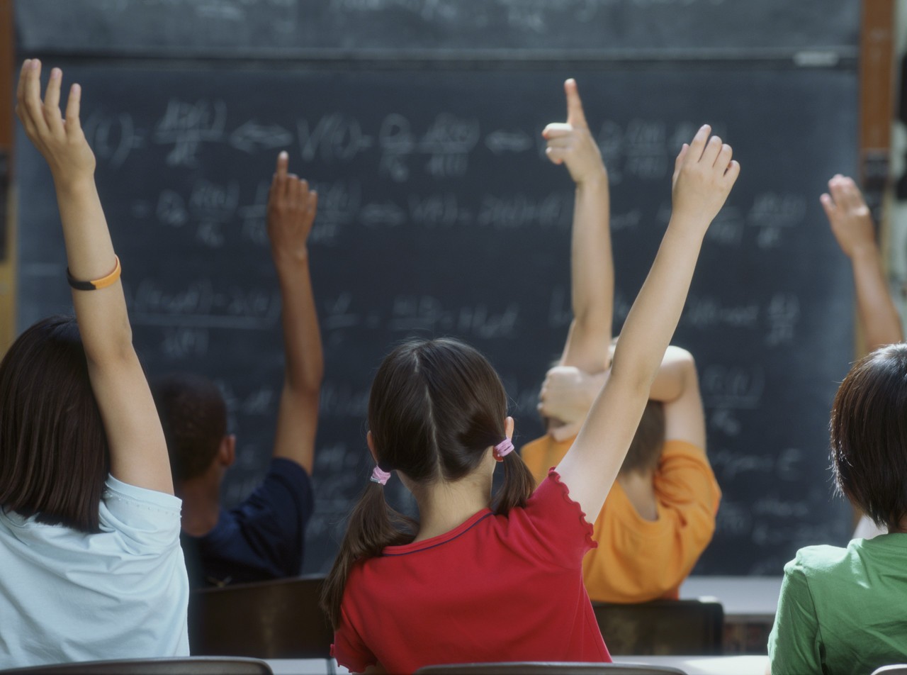 students_hands_raised.jpg