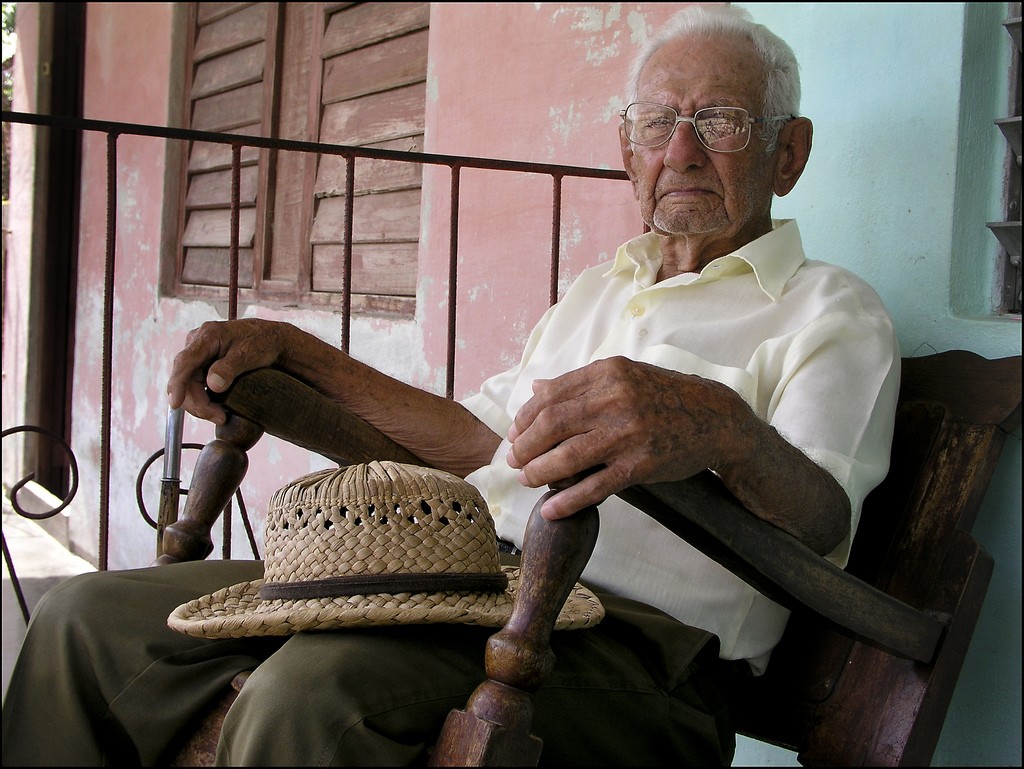 an-old-man-was-sitting-on-his-.jpg